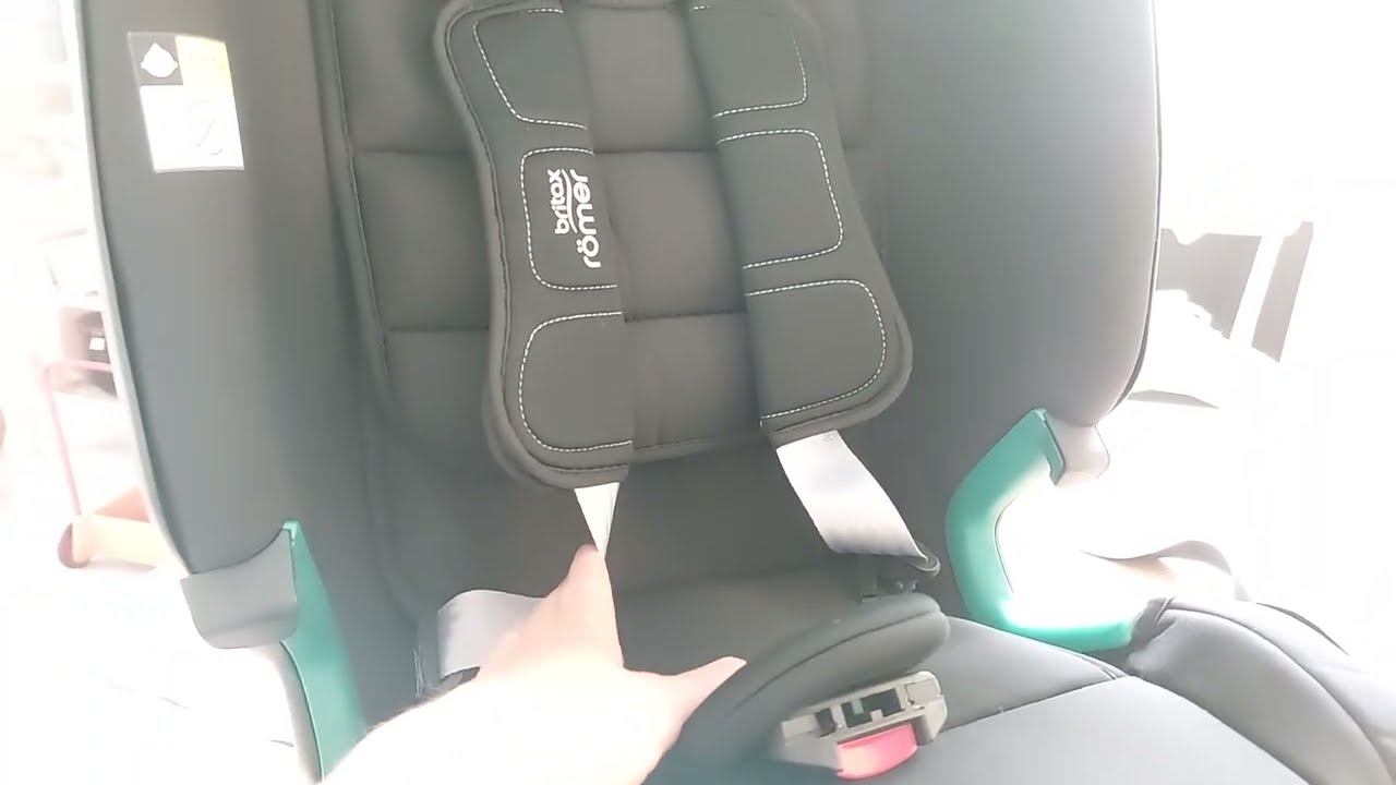 Loosening belt of Britax Romer child car seat.